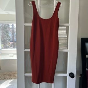Over sized brown/ terra cotta body icon dress!